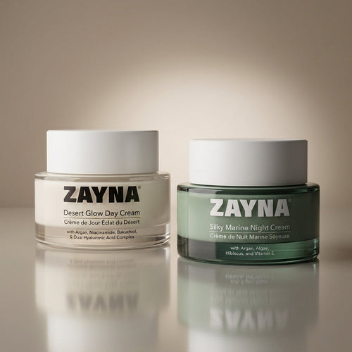 ZAYNA Sable et Mer day and night cream set featuring Desert Glow and Silky Marine jars on a reflective surface.